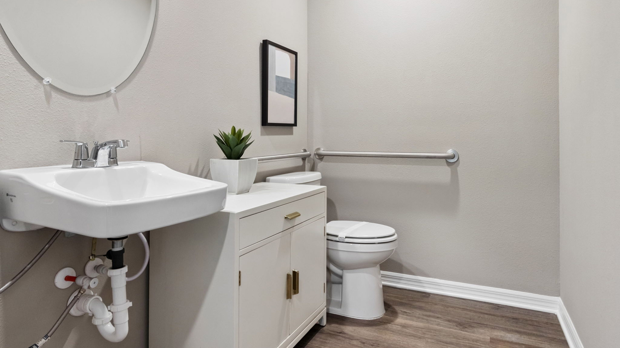master bathroom showing double vanity with quartz countertops with access to walk-in closet.