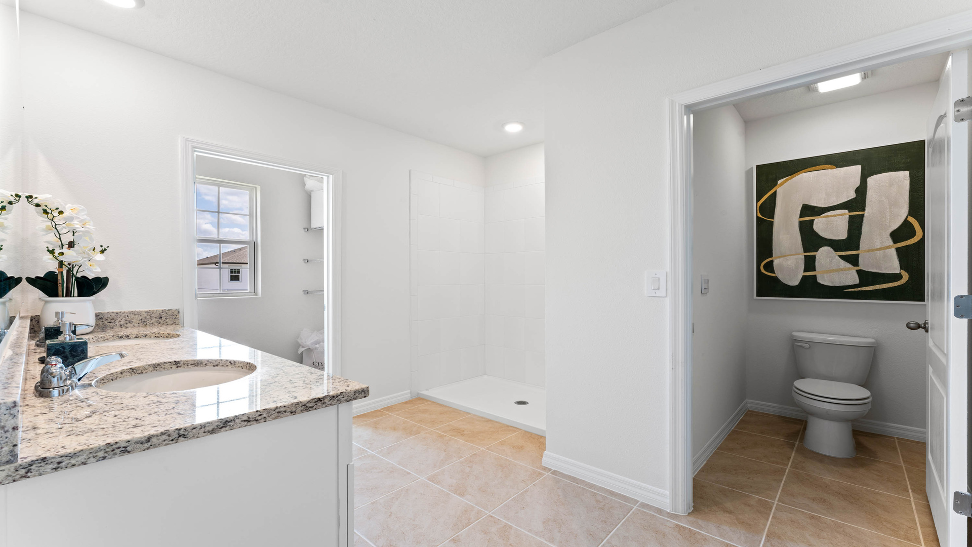 Master bathroom showing access to private lavatory, walk-in closet, and master bedroom.