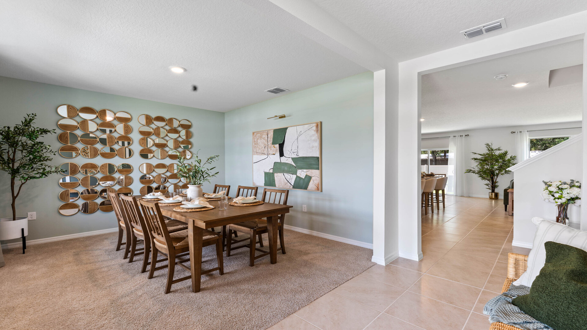 Spacious dining room with table and seating by entry way.