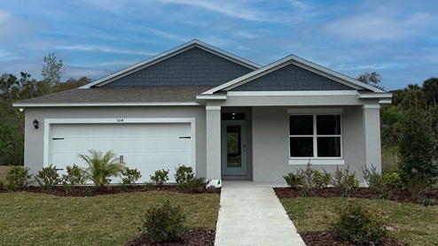 Single story new home with front porch and 2 car garage.