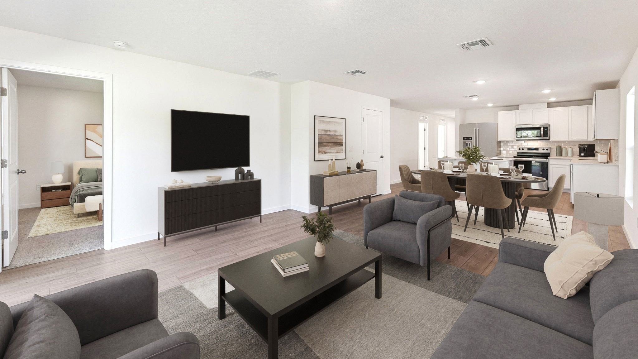 Living area with couch seating, entertainment system and natural lighting
