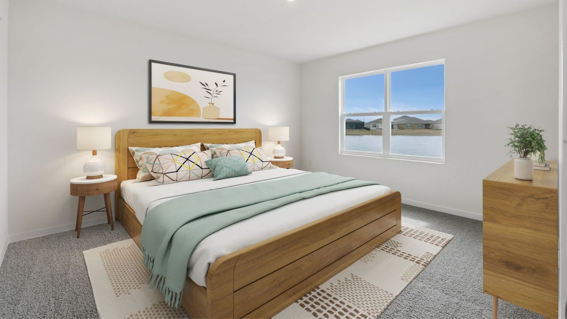 Guest bedroom with bed, nighstands and natural lighting and spacious closet.