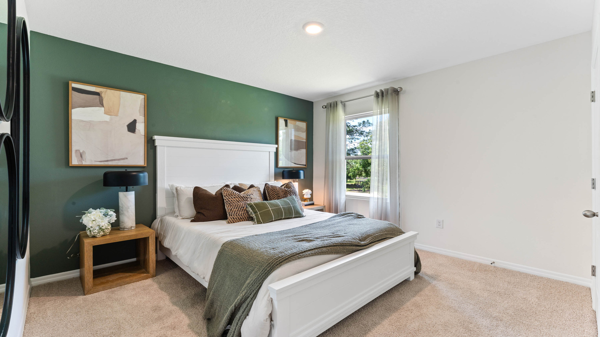 Guest bedroom with bed, nightstands and a roomy closet for storage.