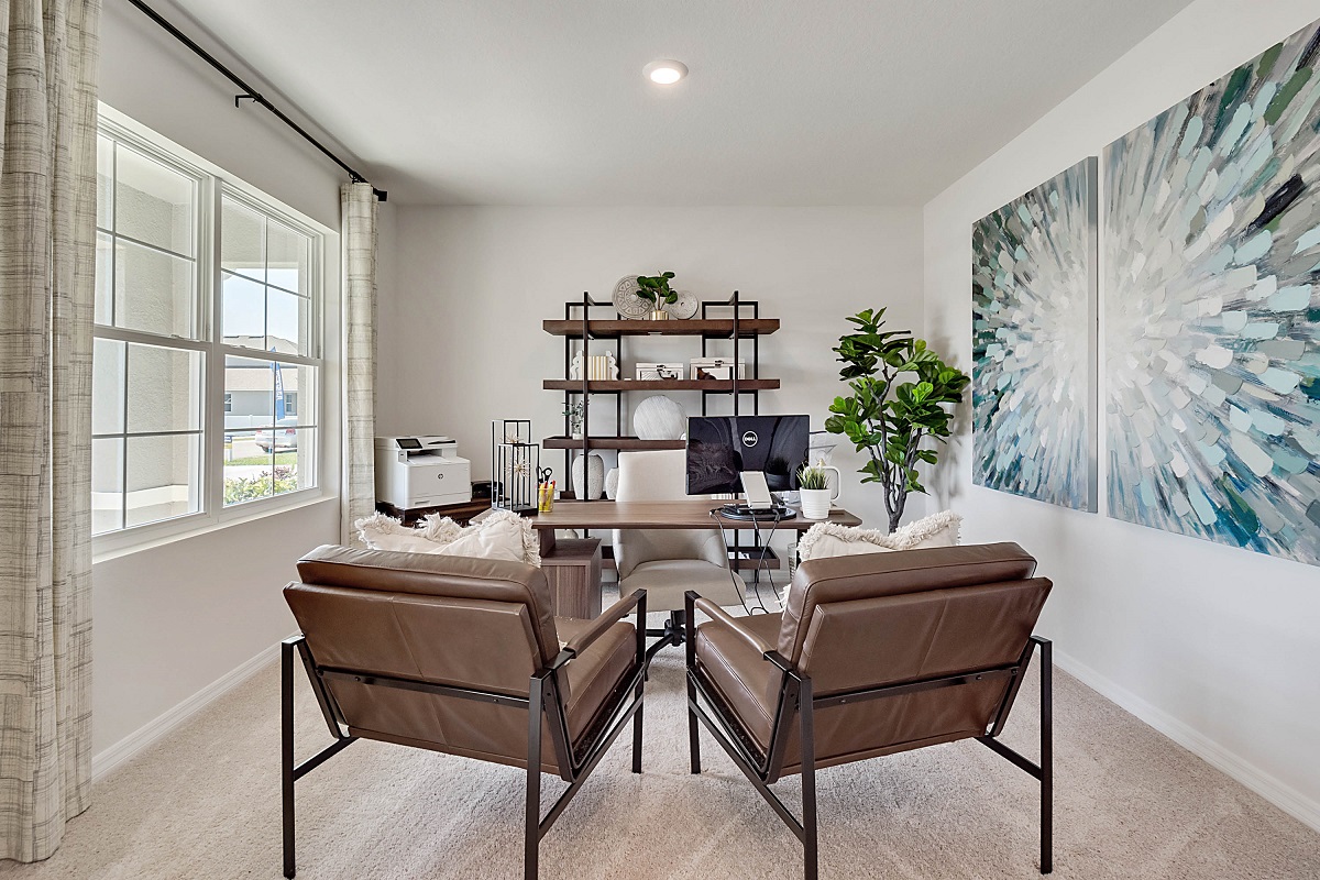 Functional home office with desk, chairs and space to work or play.