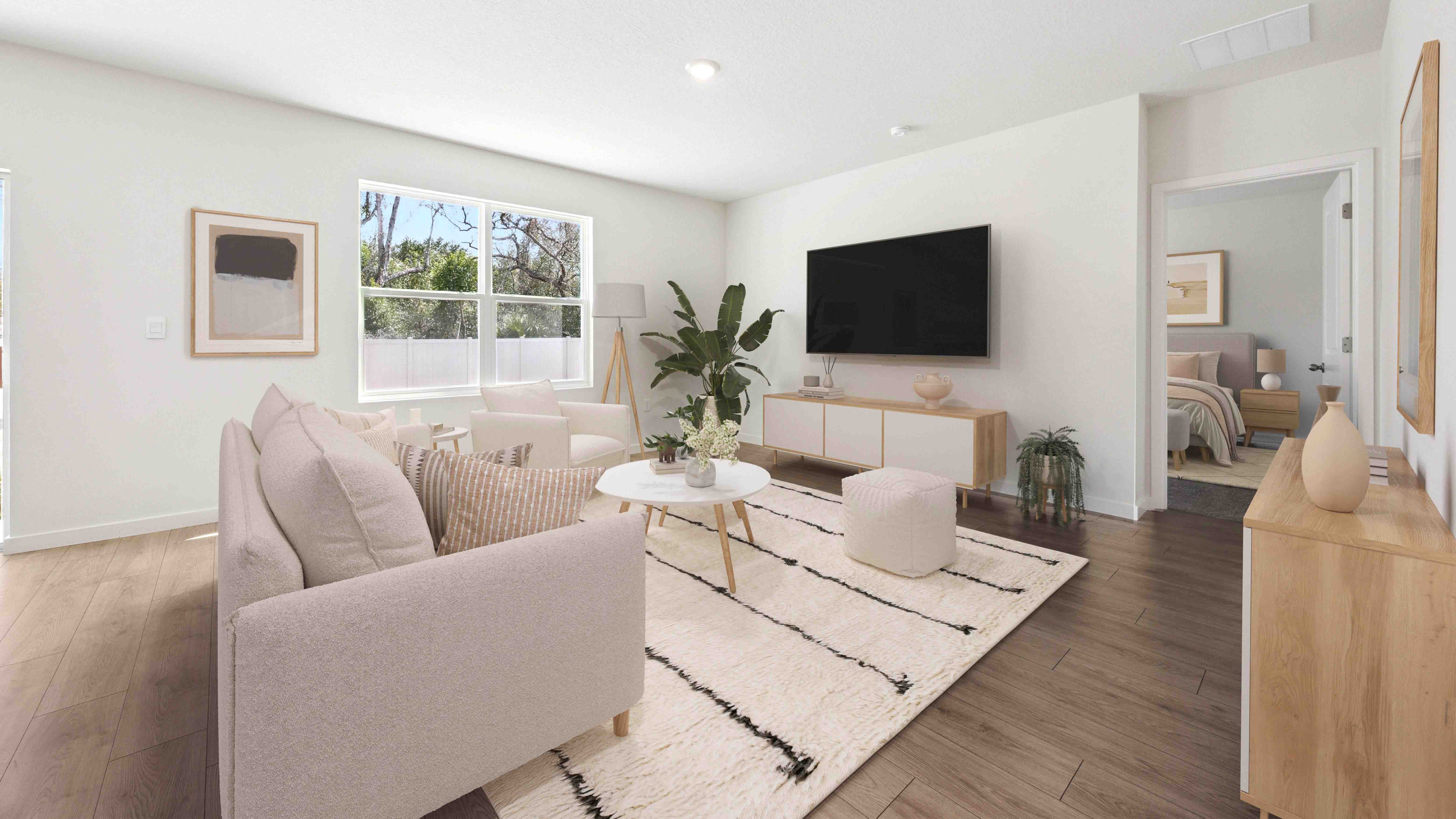 Living area with RevWood Select flooring overseeing sliding door