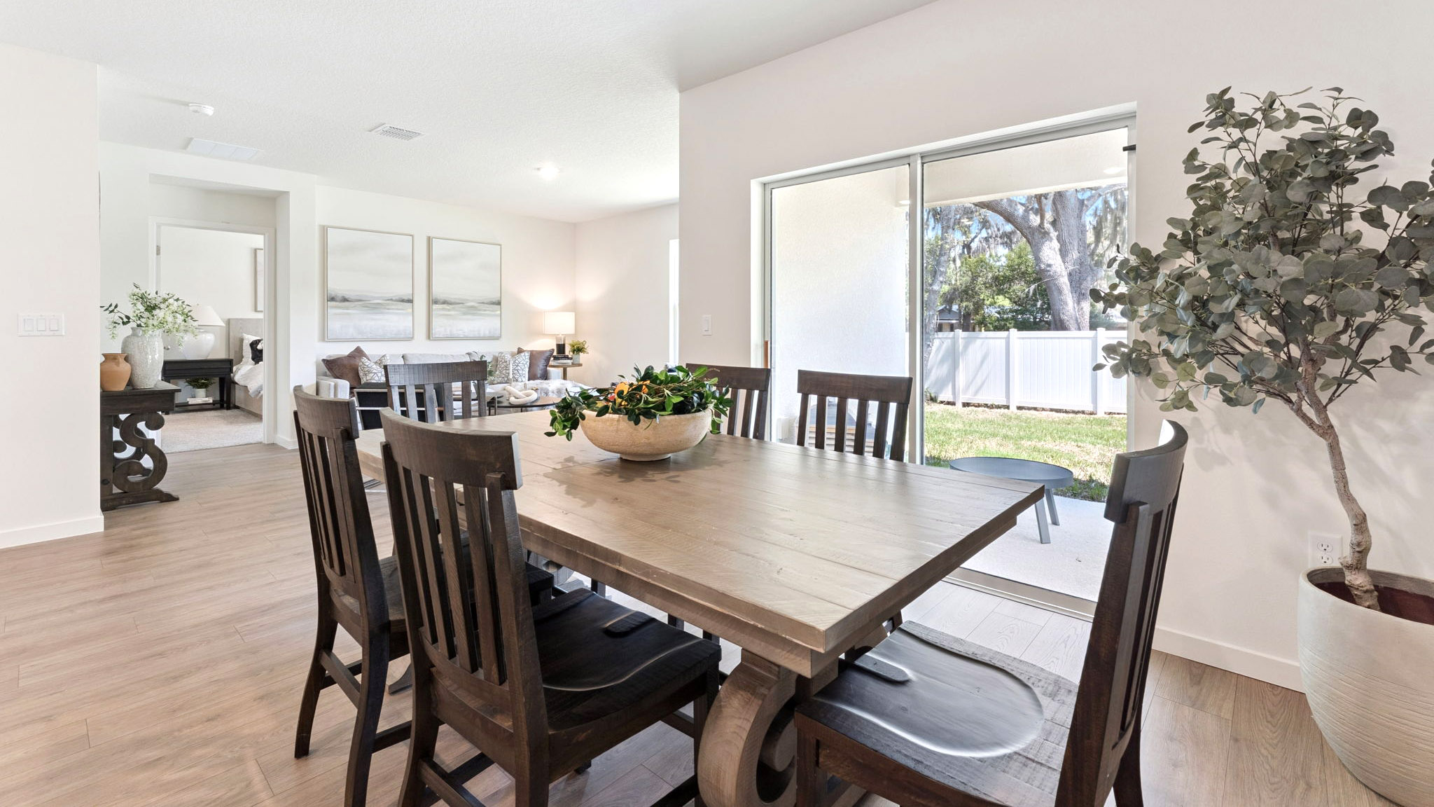 Dining room area with table, seating and natural lighting.