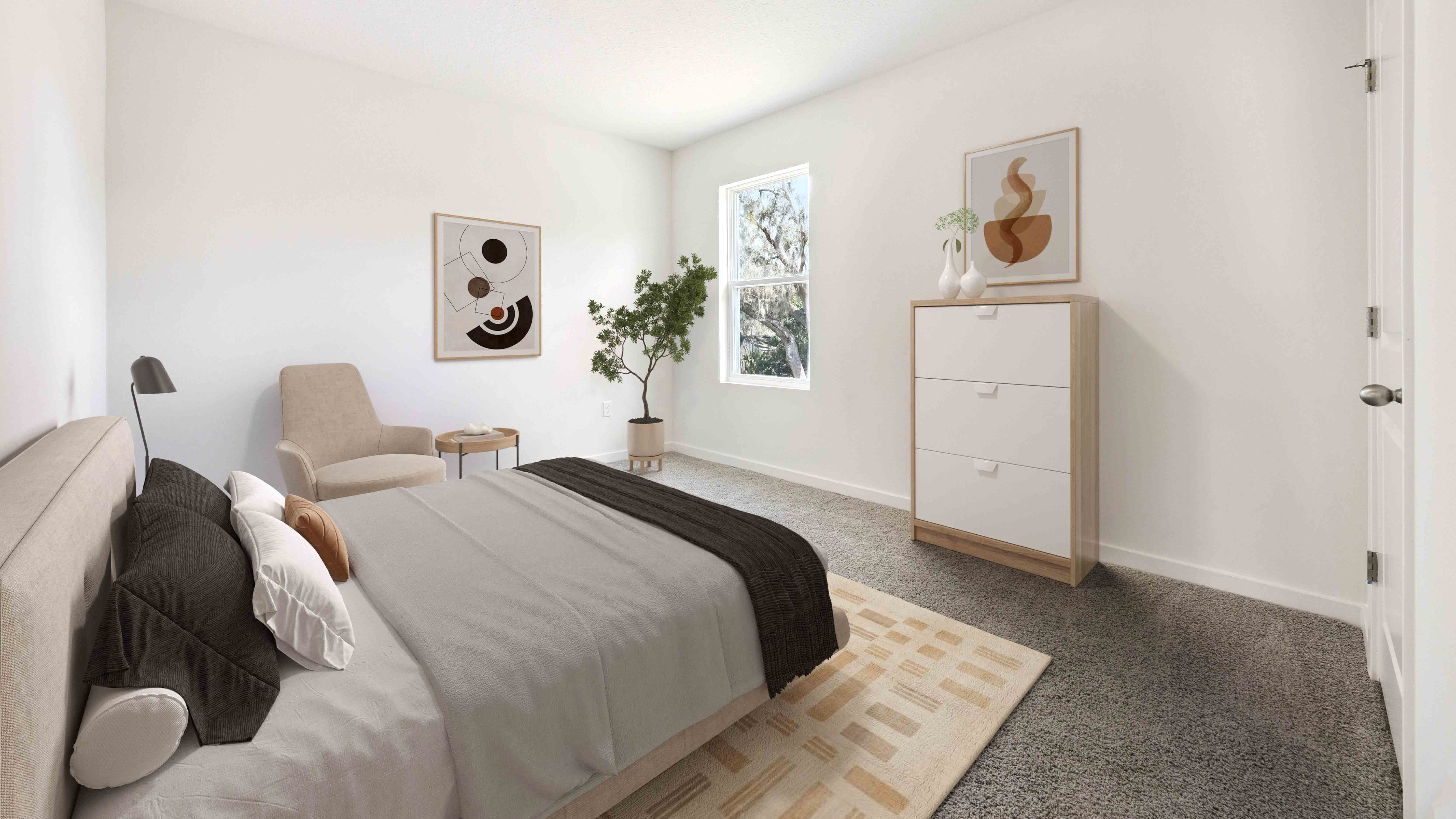 Spacious primary bedroom with king size bed, carpet flooring, natural lighting.