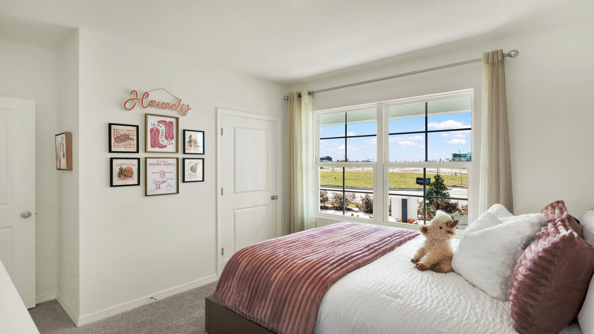 Guest bedroom with bed, nighstands and natural lighting.