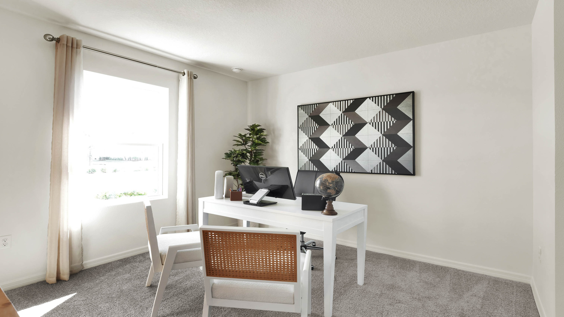 Functional home office with desk, chairs and space to work or play.