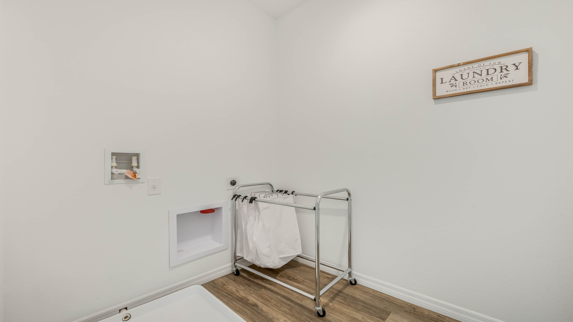 Potential spacious laundry room.