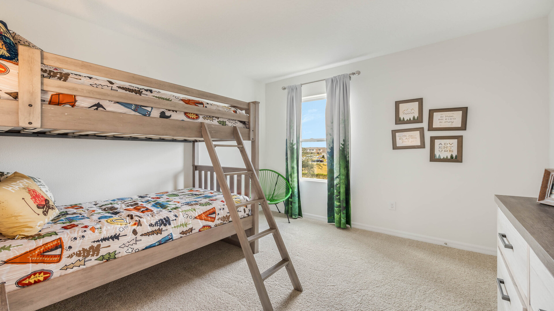 Guest bedroom with bed, nighstands and natural lighting.