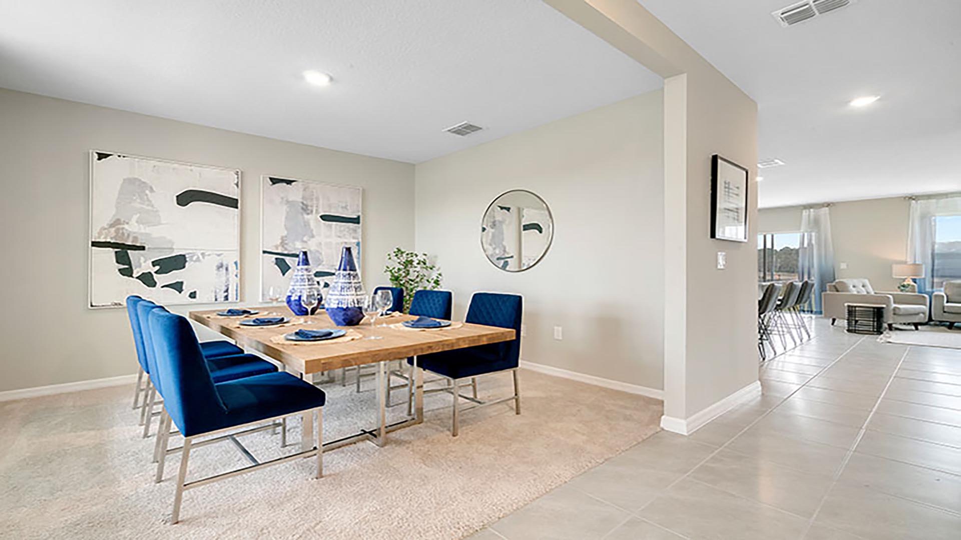 Dining room area with seating and natural lighting.