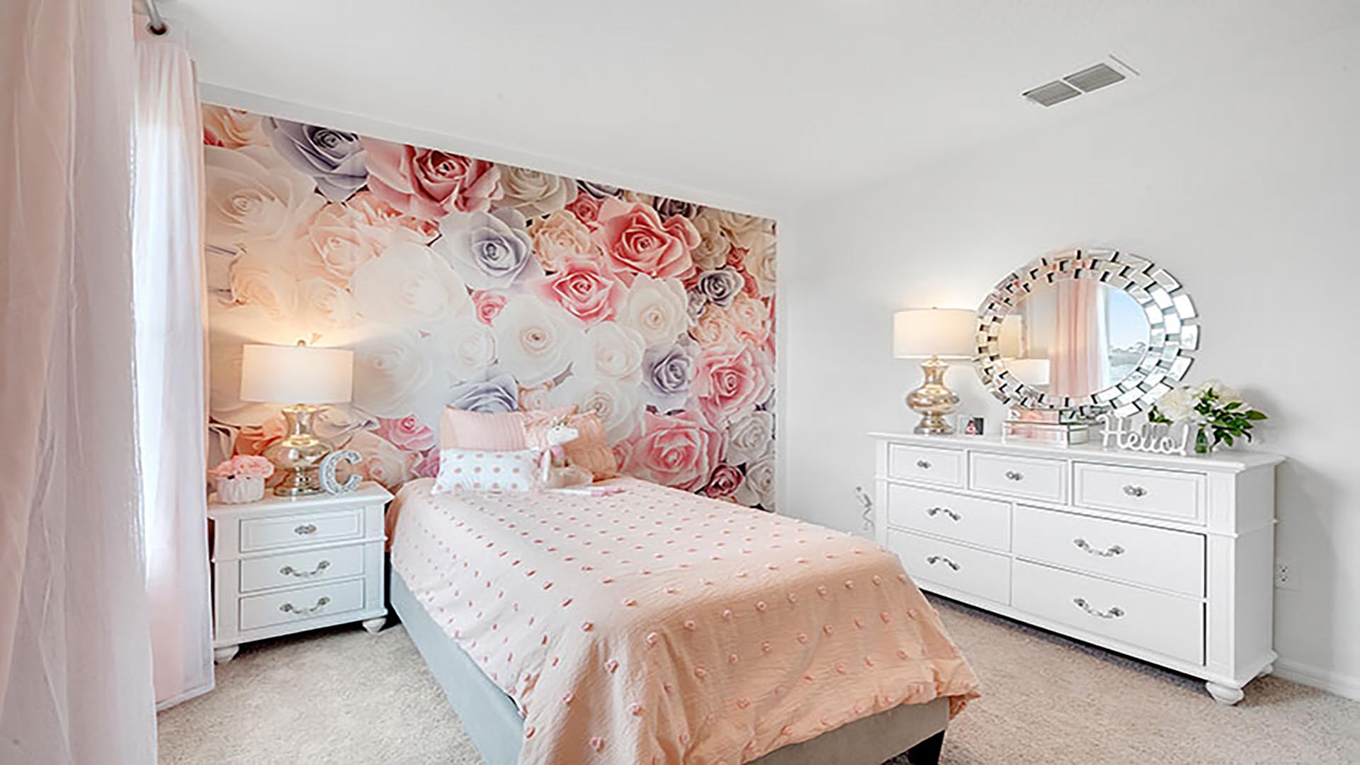 Guest bedroom with bed, nighstands and natural lighting.