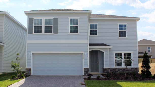 Two-story exterior with light siding and covered porch and garage