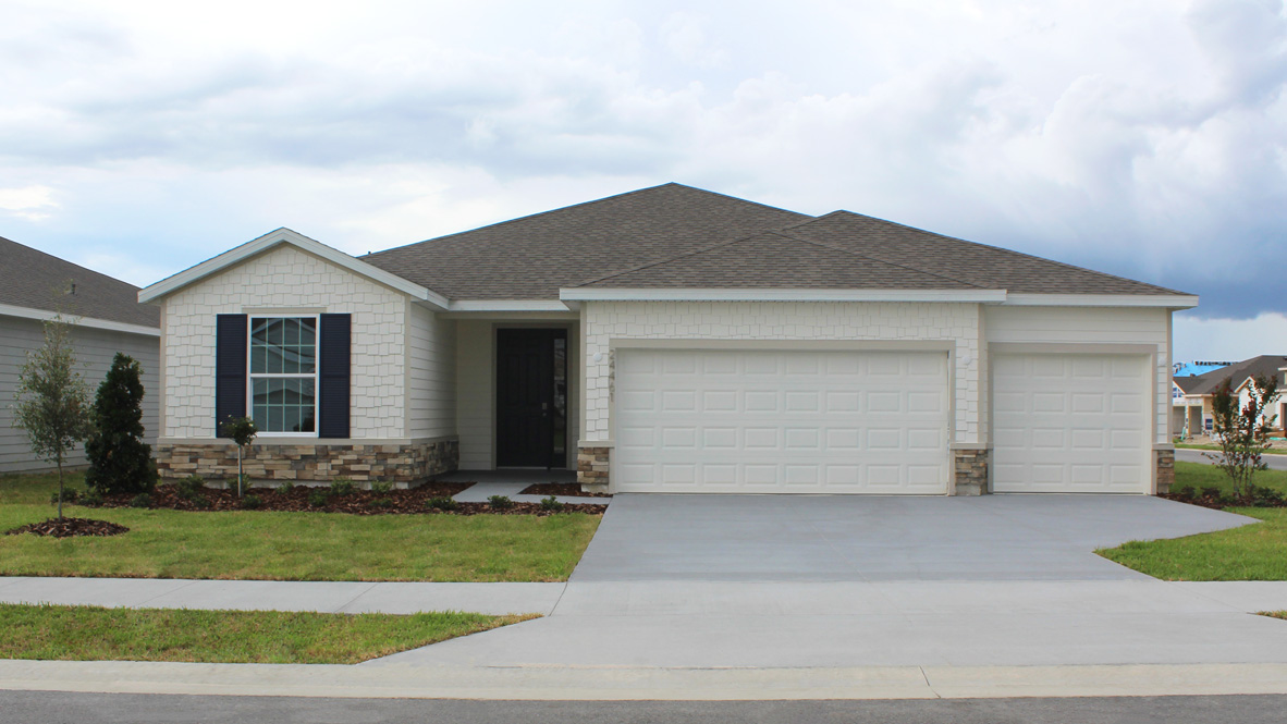 single-story exterior with gray siding and front window and garage