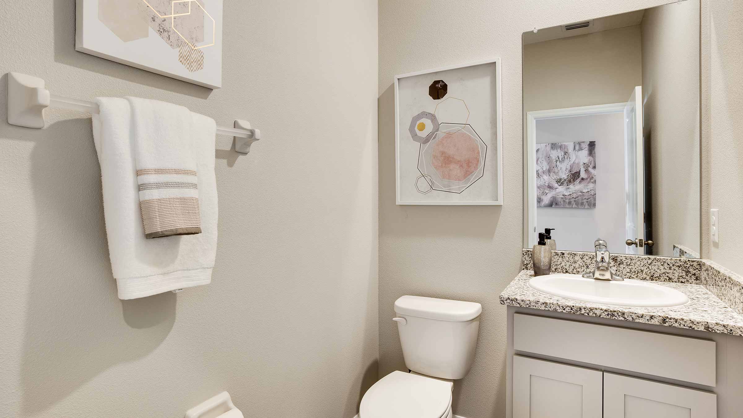 Camden Half Bath with shower and sink and white cabinet