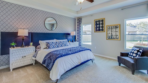 Main bedroom furnished with king bed