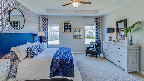 Main bedroom furnished with king bed