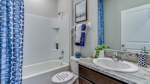Guest bathroom with tub and shower combo