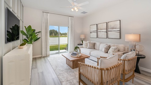 Living Room with sliding glass doors to back yard. Neutral coastal decor
