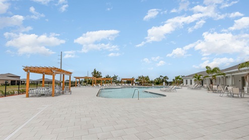 Resort-Style Swimming Pool with plenty of seating