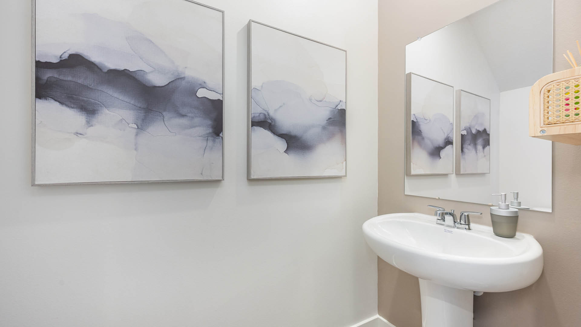Cozy powder bathroom with pedestal sink.