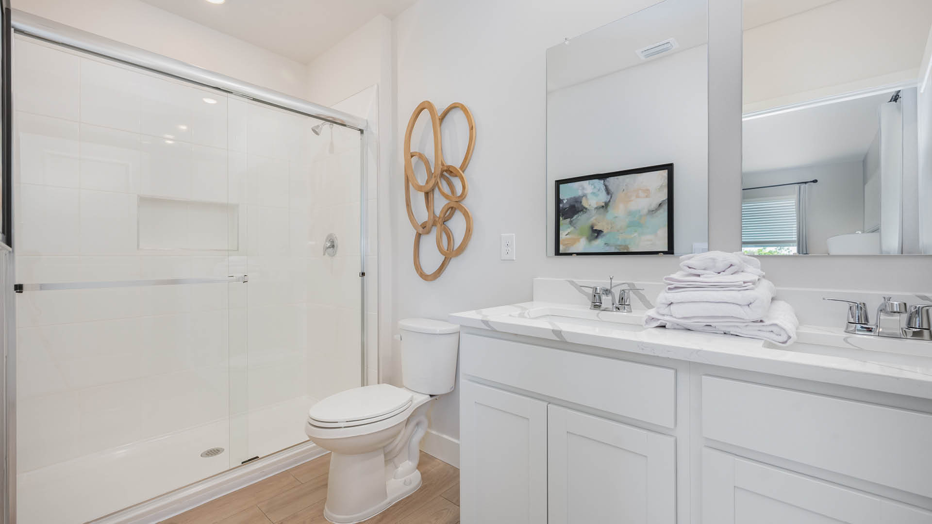 Primary bathroom with quartz countertops and undermount sink.