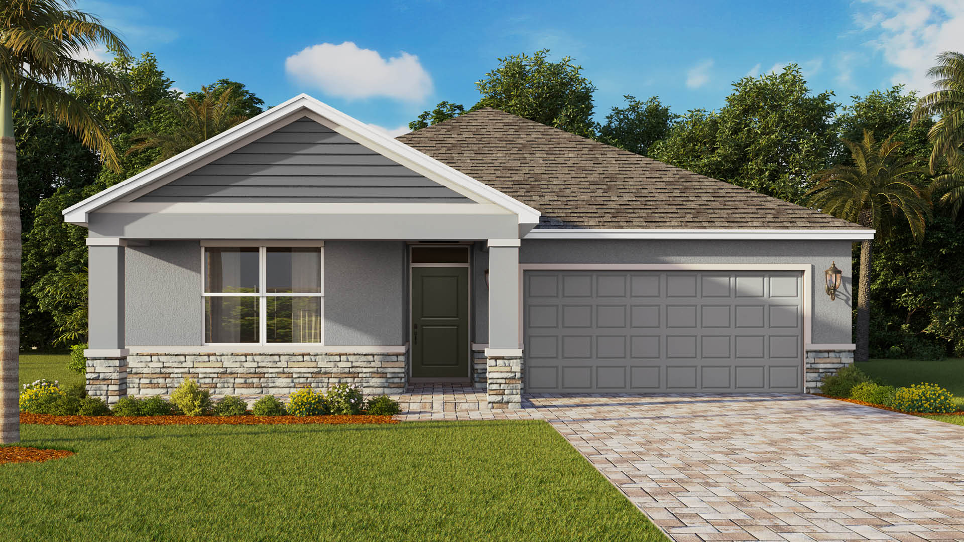 A single-story home featuring a gabled roofline over a covered front porch, dark gray siding and stucco walls with stone accents along the base, and a brick paver driveway leading to a matching gray two-car garage.