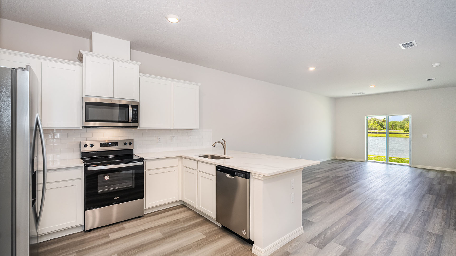A large kitchen and dining area featuring a sliding glass door.