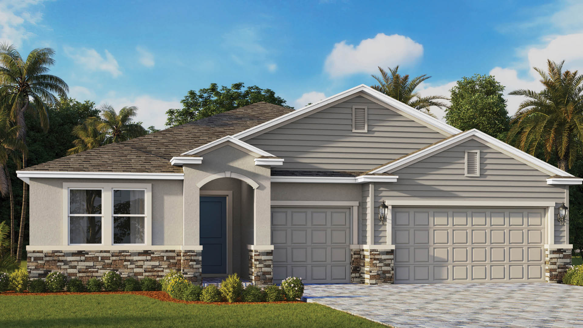 A modern single-story house with grey siding, stone accents, and three car garage with paver driveway.