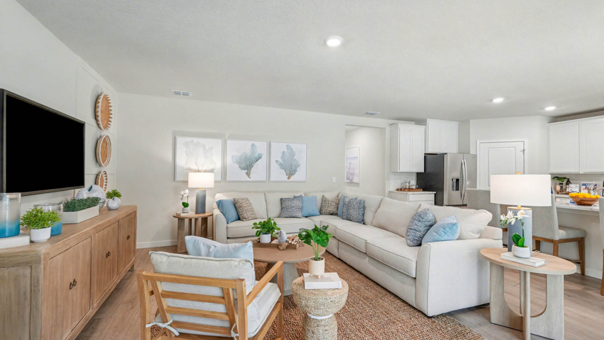 A tidy living room featuring a couch, coffee table, and television, creating a cozy and inviting atmosphere.