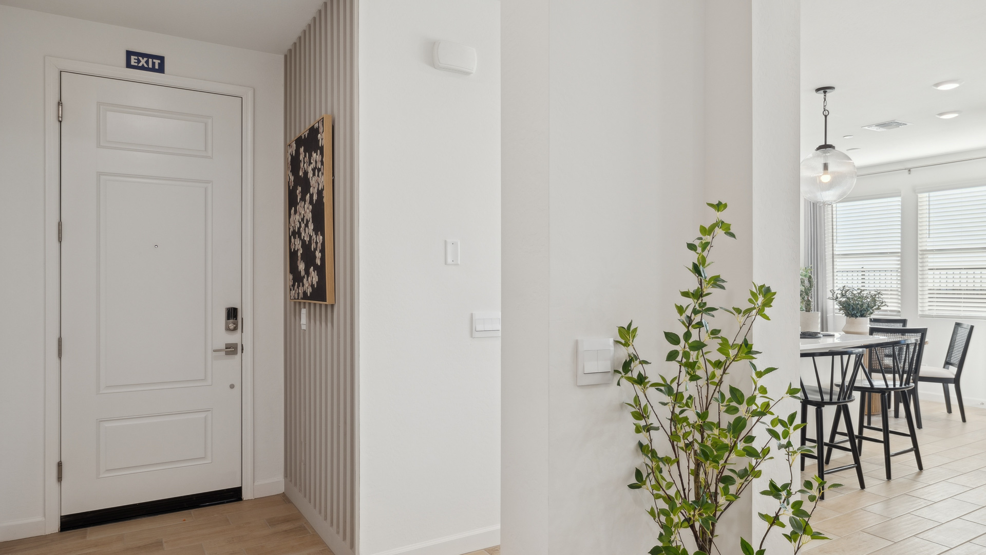 Entry hallway inside front door next to flex space with direct line of sight to main living areas
