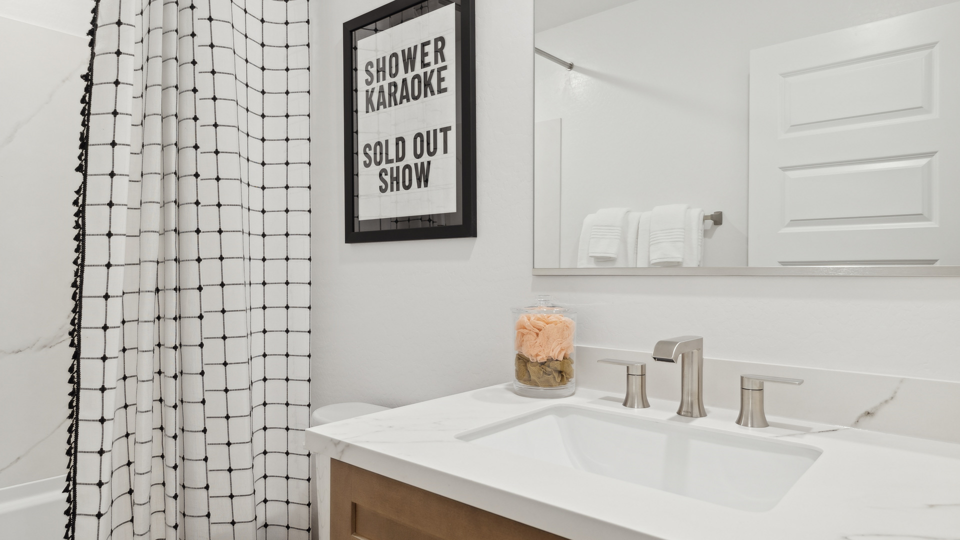 Family full upstairs bathroom adds stylish vanity, mirror, cabinets, and tub-shower combo