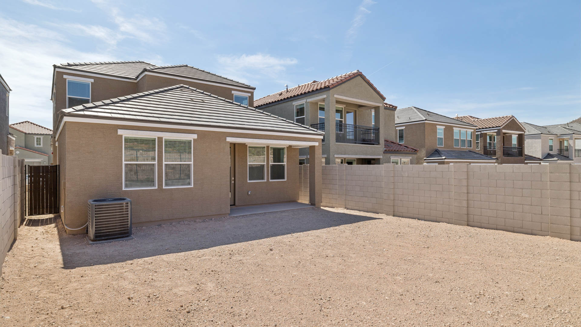 Large fenced-in backyard with a covered patio, perfect for outdoor entertaining.
