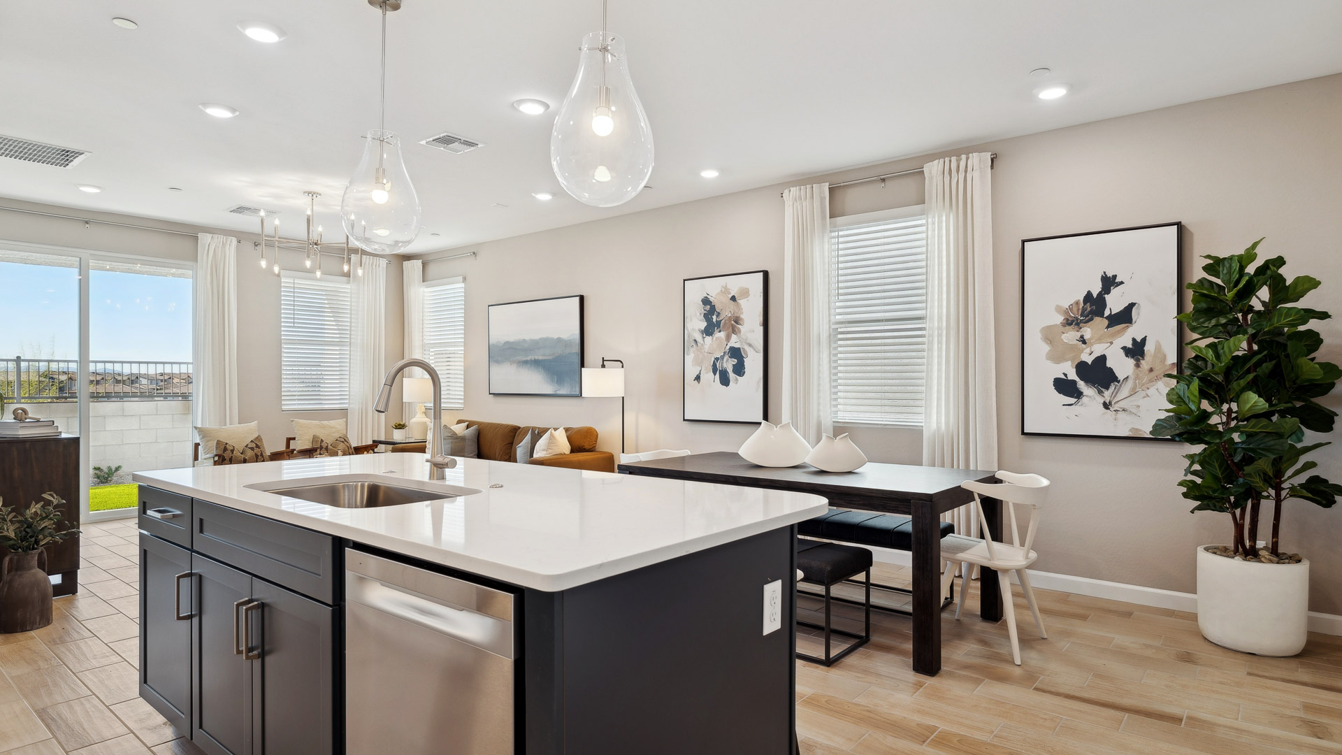 Open concept kitchen with living room and island.