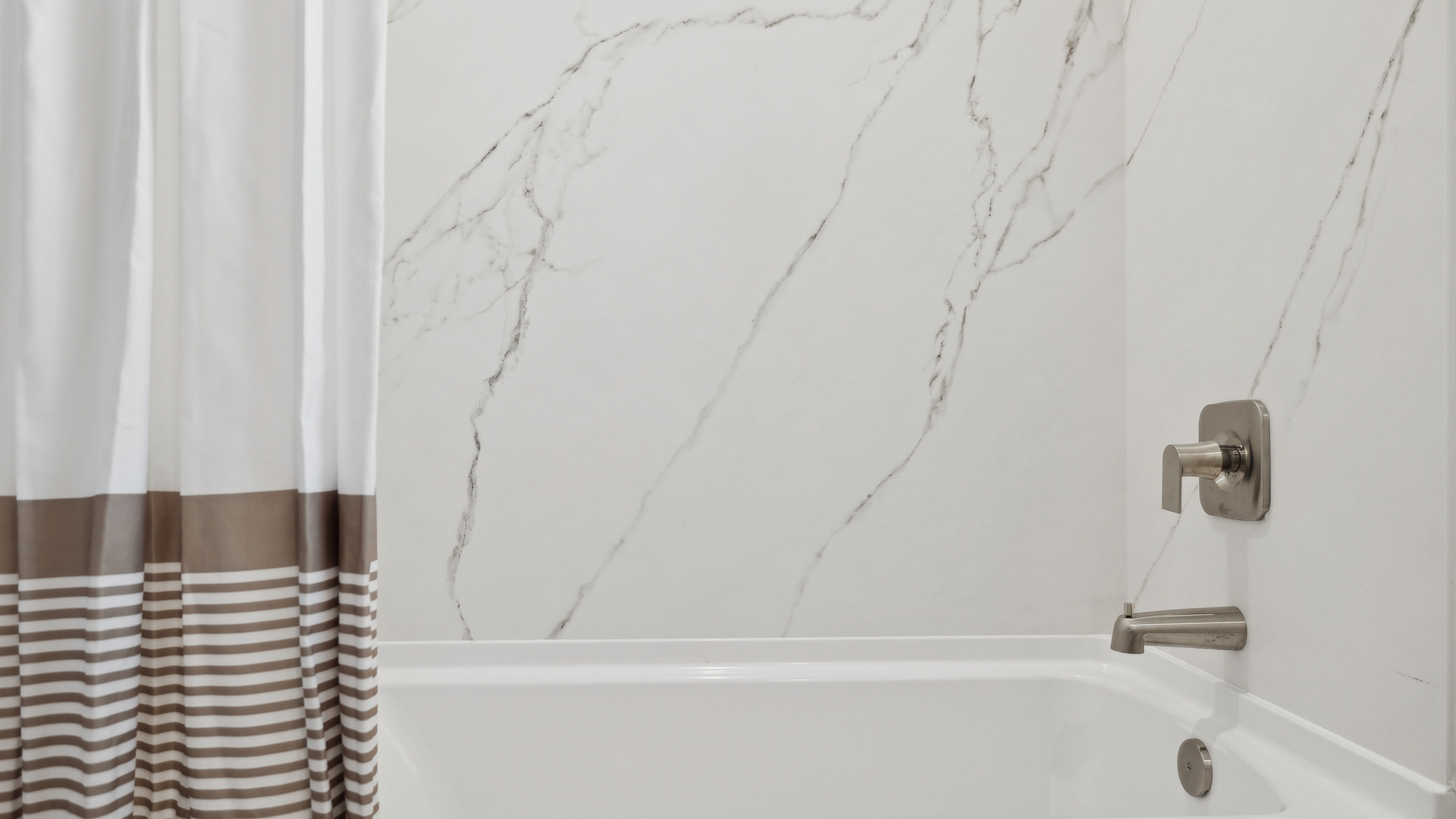 Bathroom with bathtub.