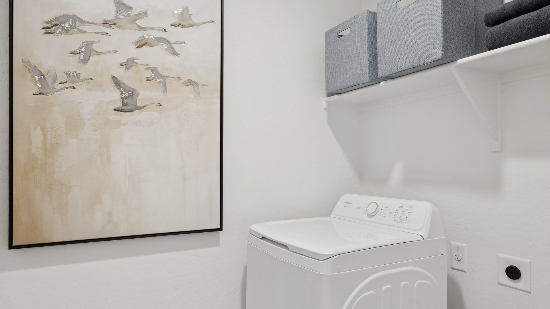 Laundry room with shelving.