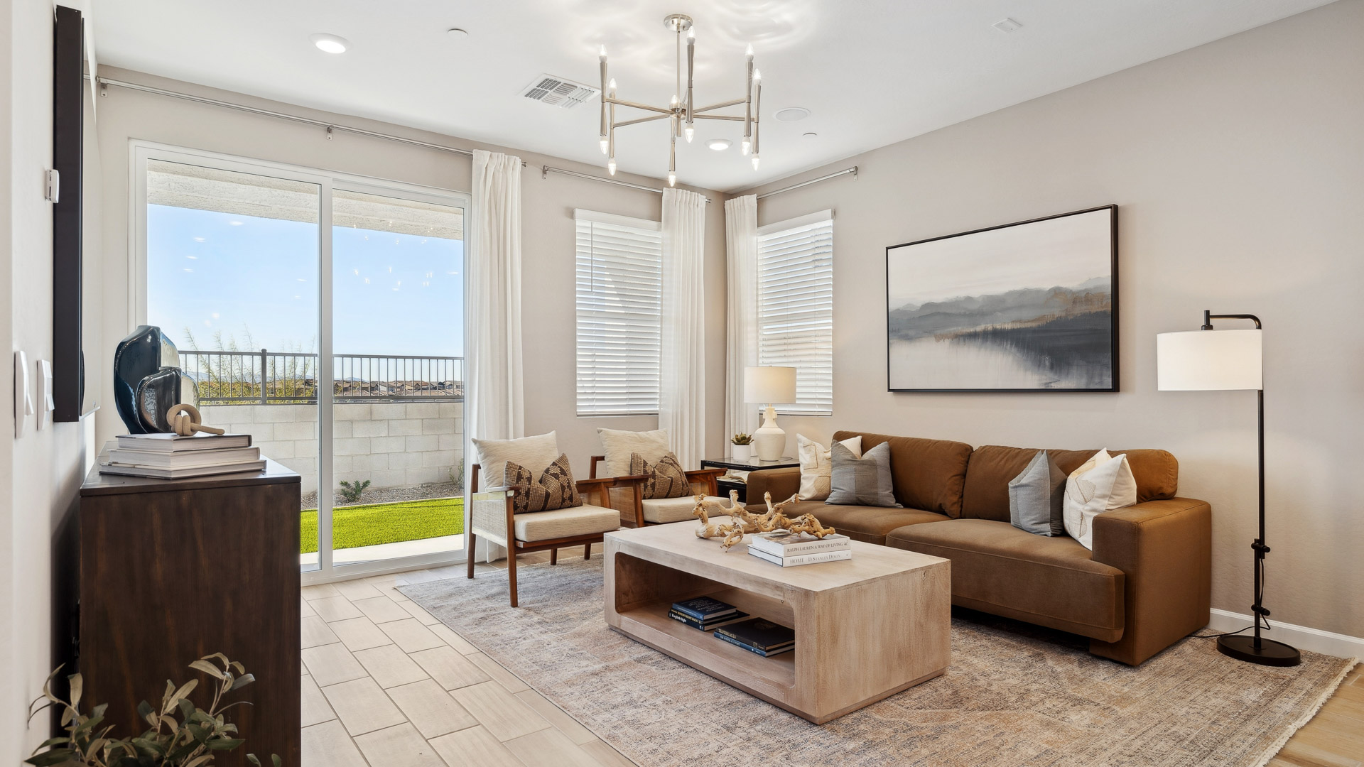 Open concept kitchen with living room and island.