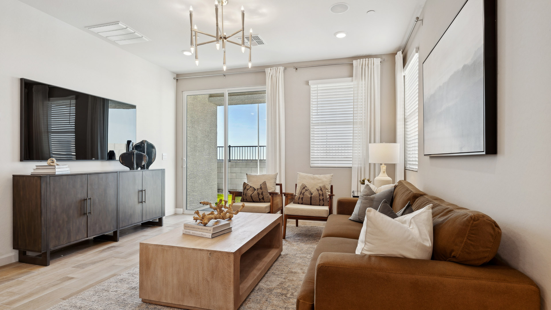 Open concept kitchen with living room and island.