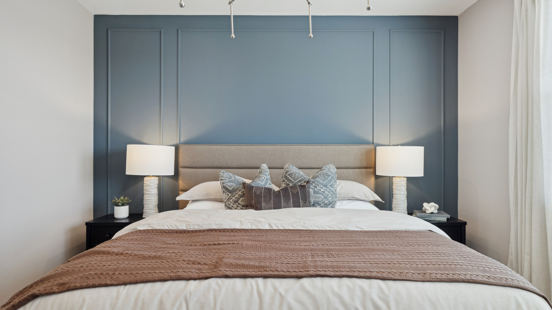 Primary bedroom designed with privacy and comfort, flows into a spa-inspired ensuite bathroom and walk-in closet