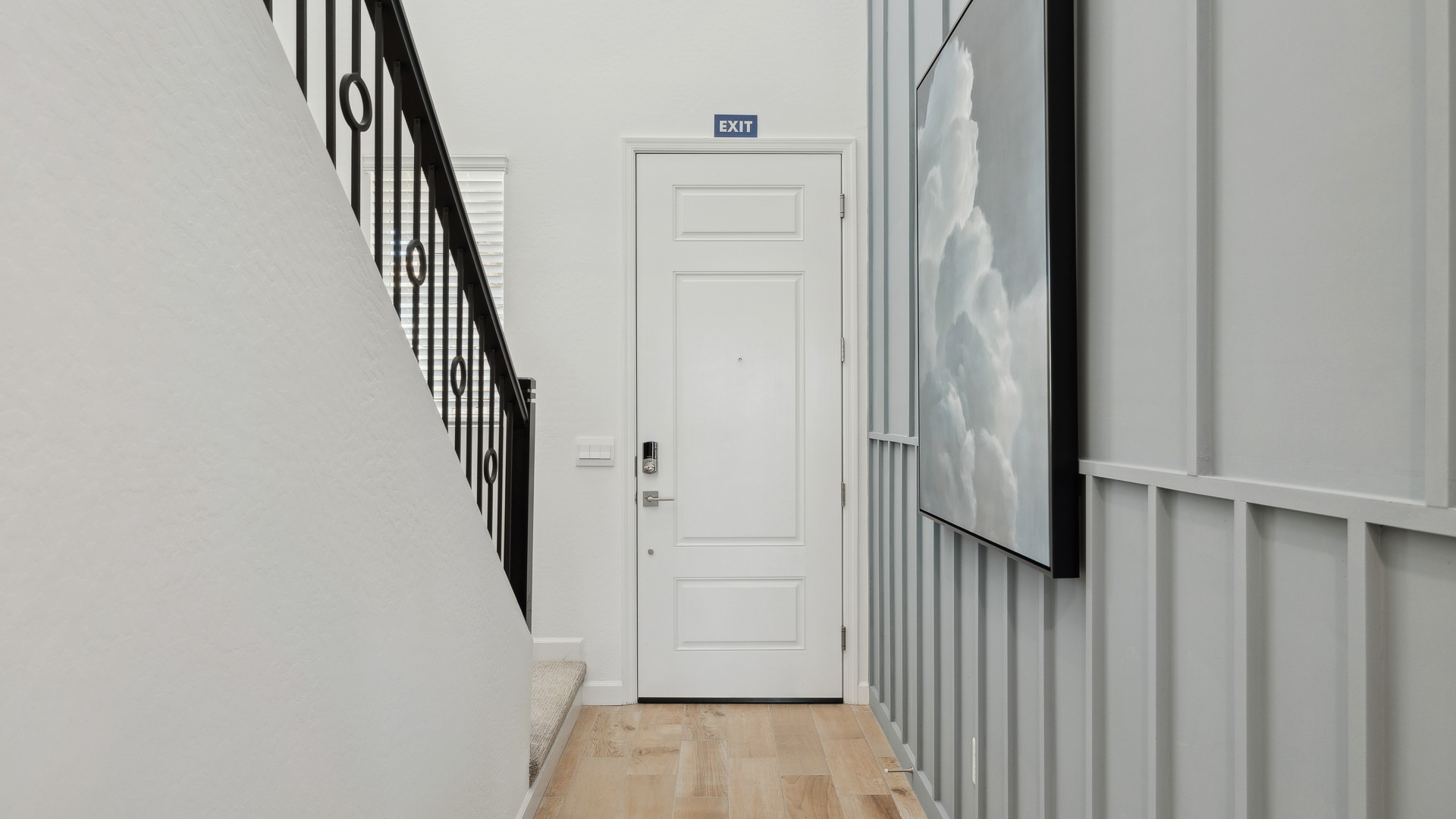 Interior hallway besides kitchen offering access to bedrooms and main areas