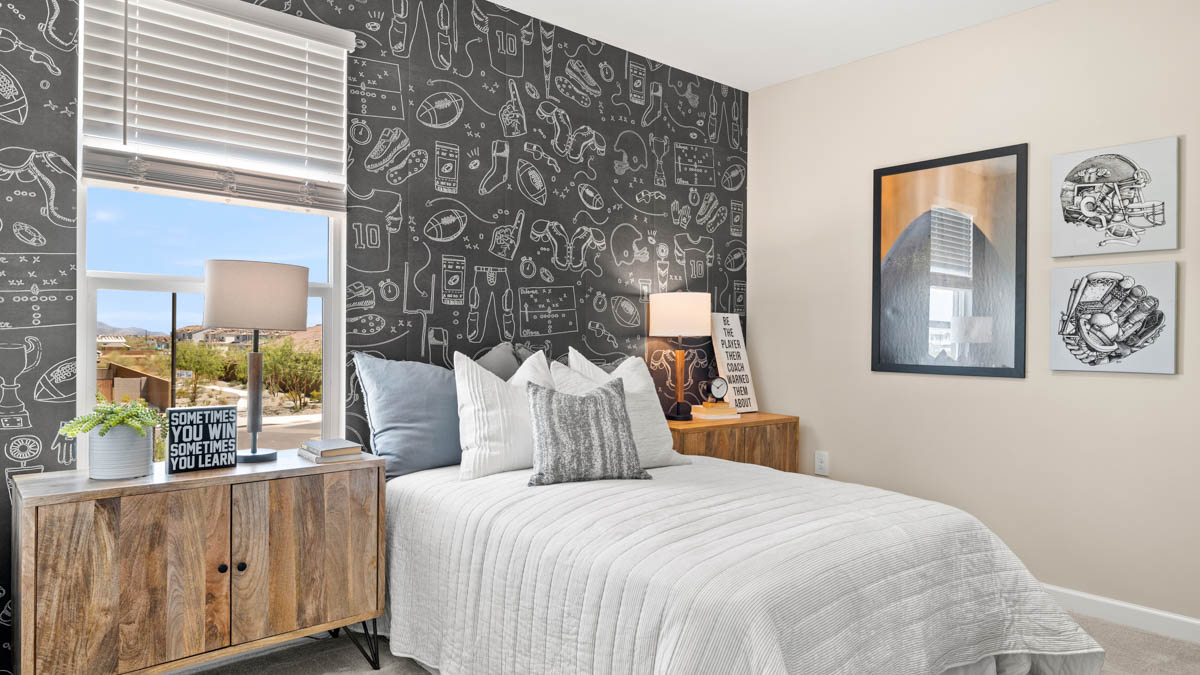 Comfortable guest bedroom featuring neutral-toned walls and a large closet.