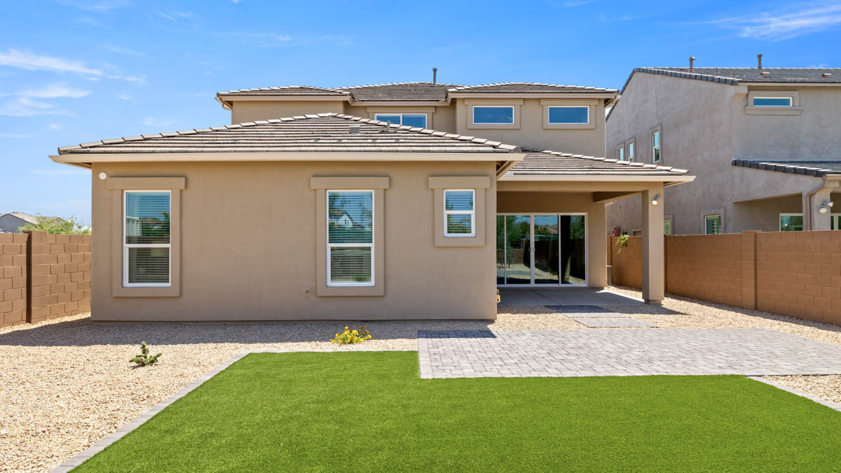 Large fenced-in backyard with a covered patio, perfect for outdoor entertainment.