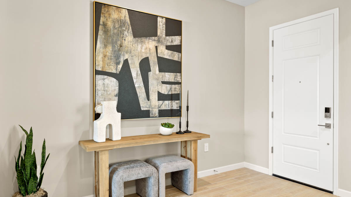 Entry hallway leading to living room and kitchen in the background.