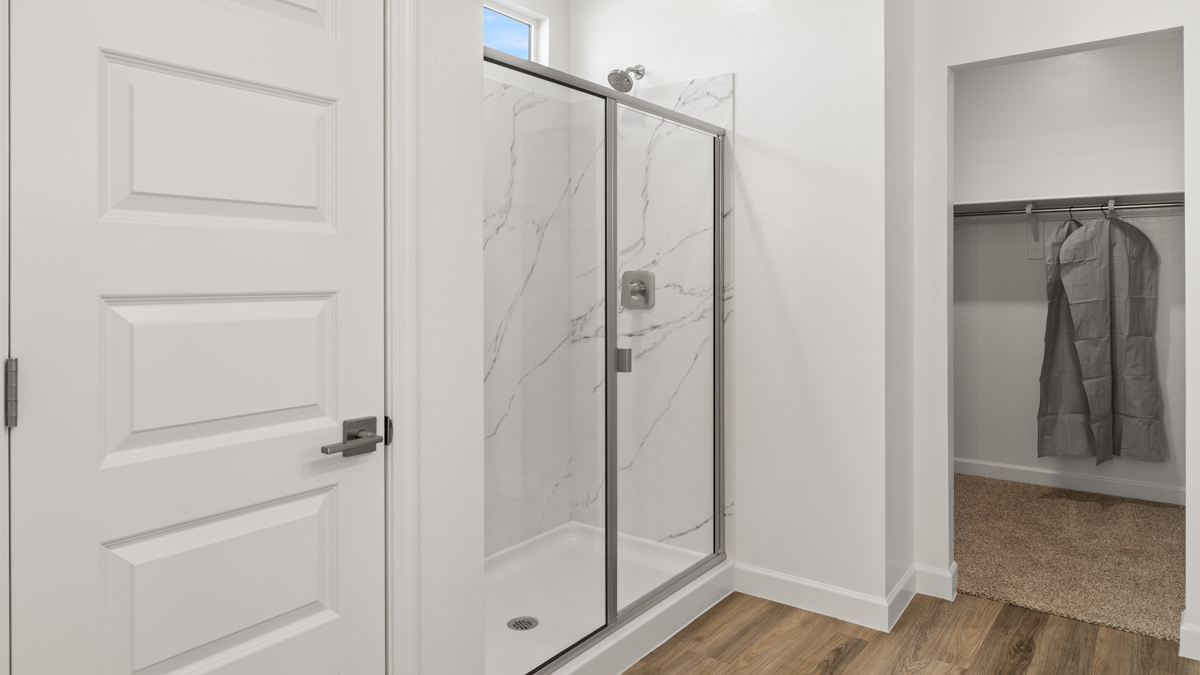 primary bathroom with dual vanities
