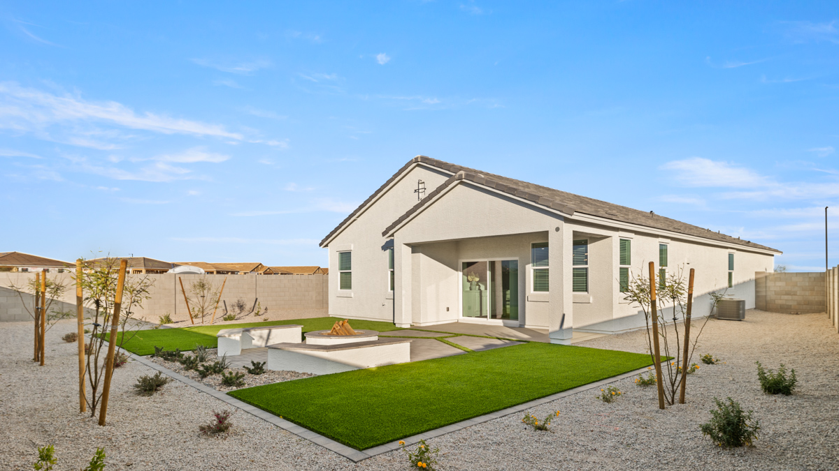 back of new home with covered patio