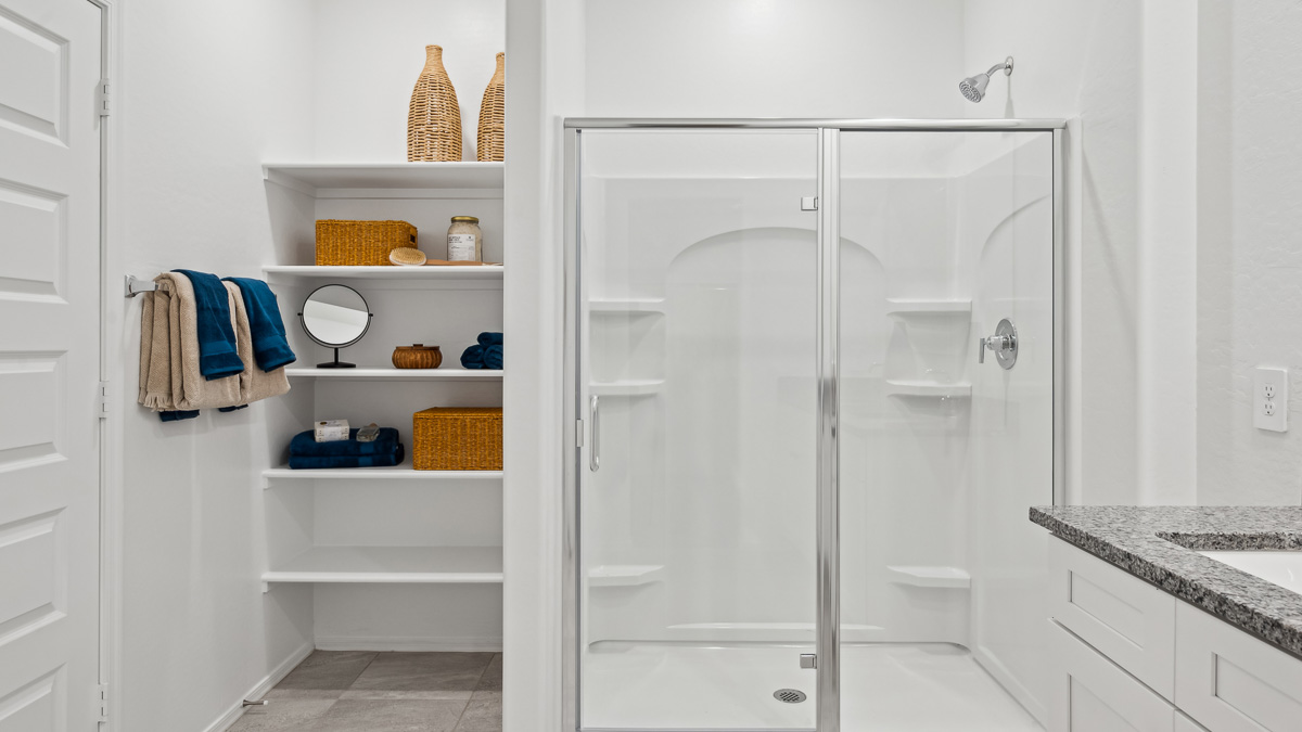 primary bathroom with dual vanities