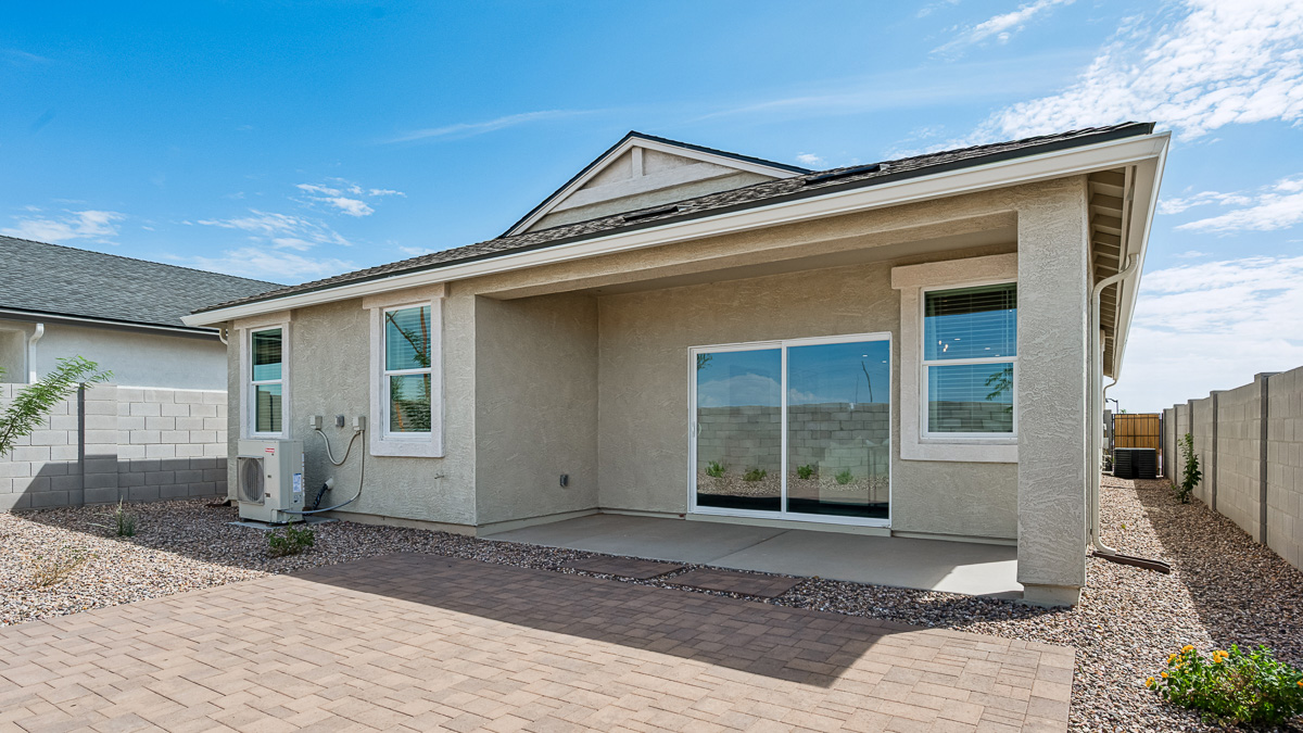 back of new home with covered patio
