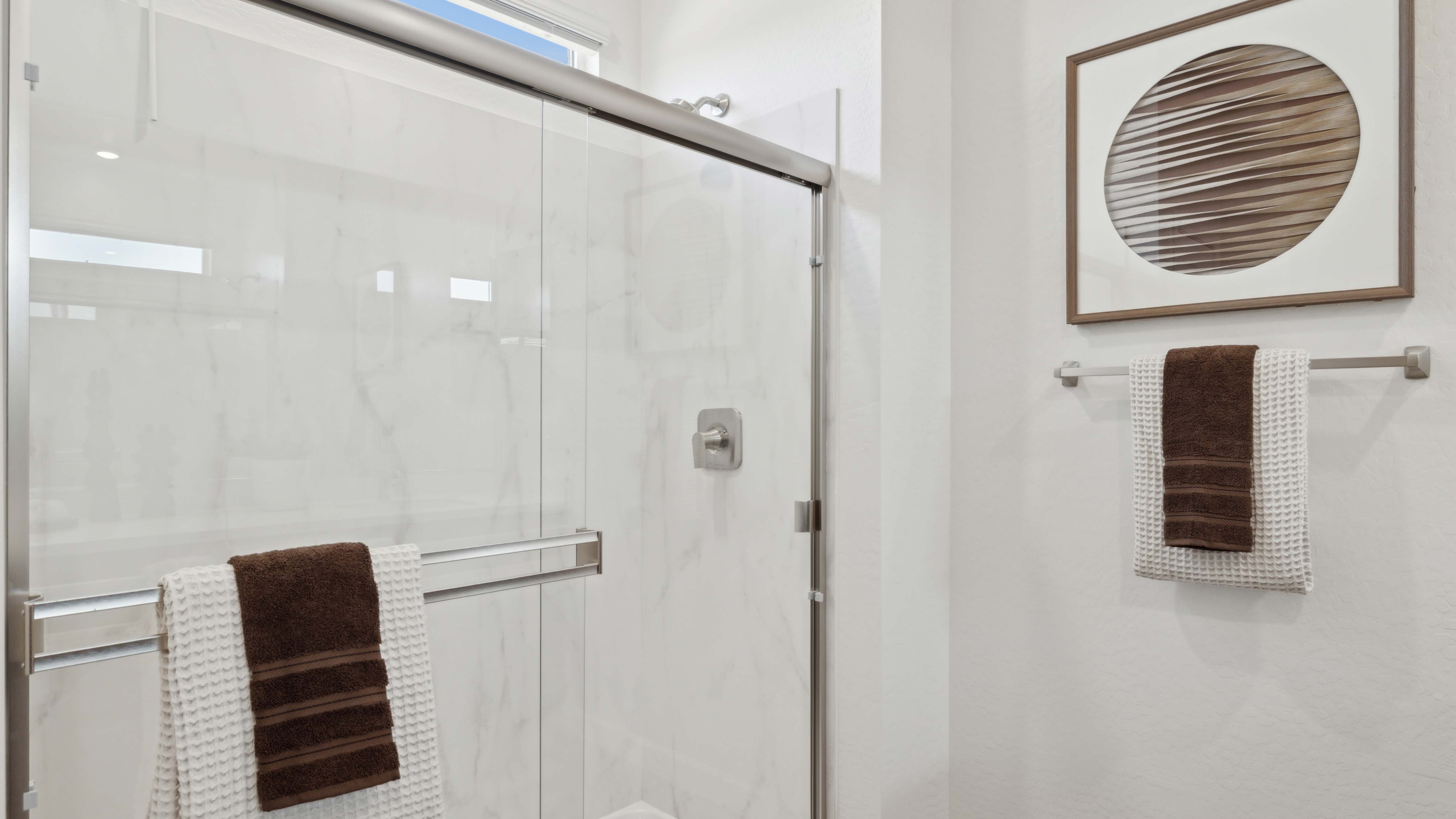 primary bathroom with dual vanities