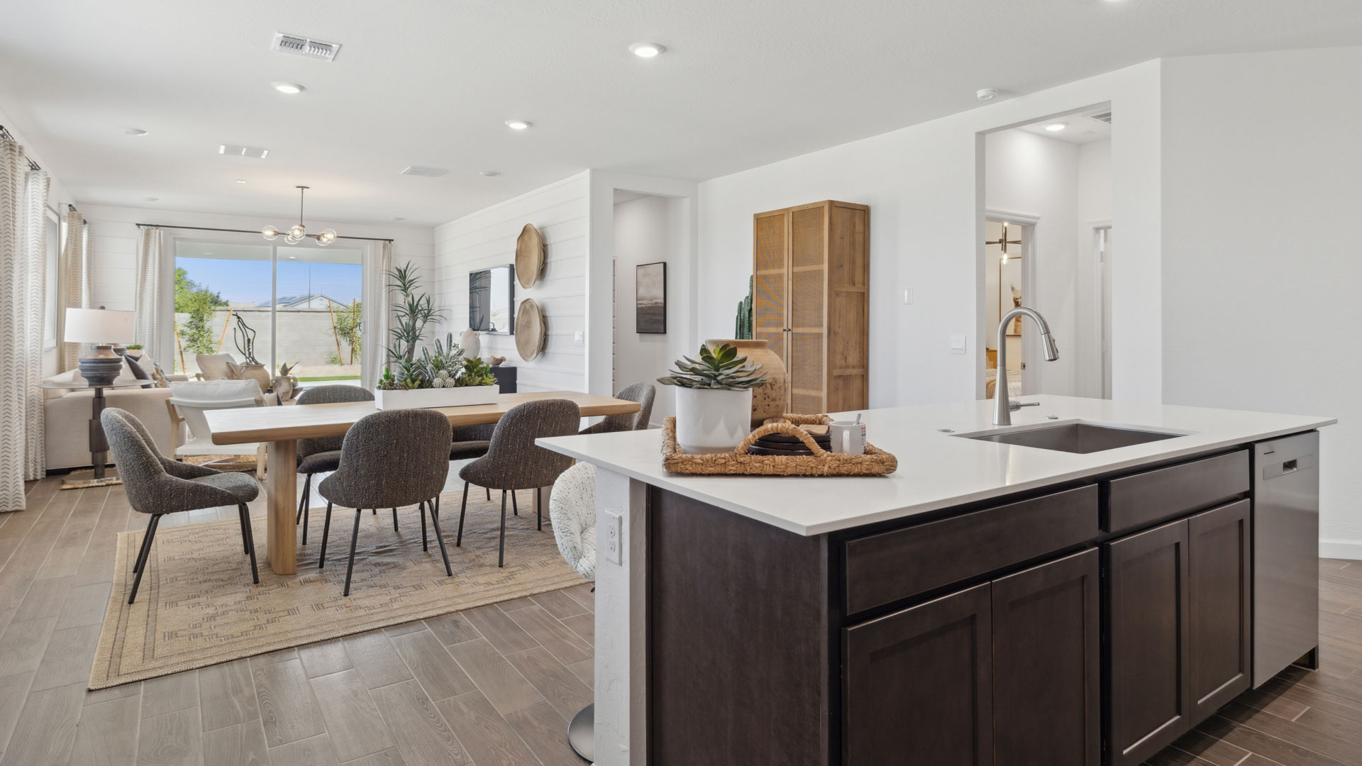 Spacious kitchen with island and stainless steel appliances.